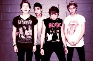 5 Seconds of Summer wear their influences on their chests?